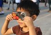 March 9, 2016: Thailand boy viewing a solar eclipse in Chiang Mai, Thailand.