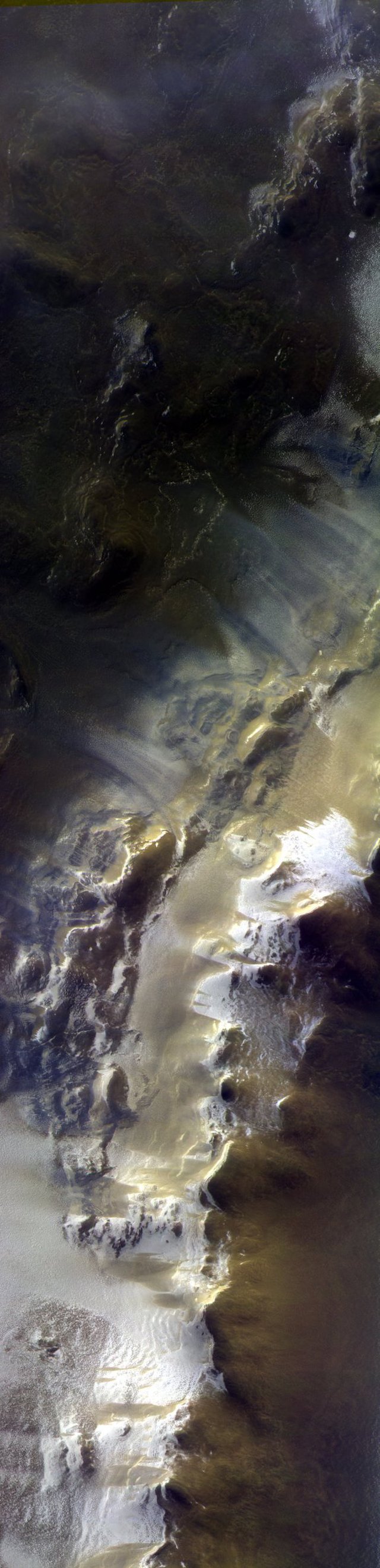 The Color and Stereo Surface Imaging System camera aboard the ExoMars Trace Gas Orbiter captured this view of the rim of Mars' Korolev Crater on April 15, 2018. The picture is a composite of three images in different colors that were taken almost simultaneously. The dimensions are about 6 by 25 miles (10 by 40 kilometers).   