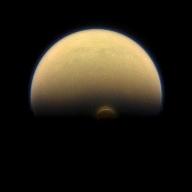 Titan as it appears from space in visible light. NASA's Cassini spacecraft captured this view in January 2013, when it was about 895,000 miles (1.44 million kilometers) from the big moon.